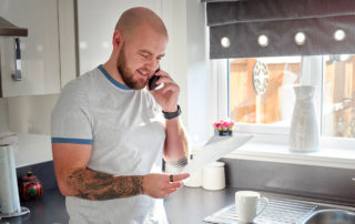 Man reading a letter and conducting research