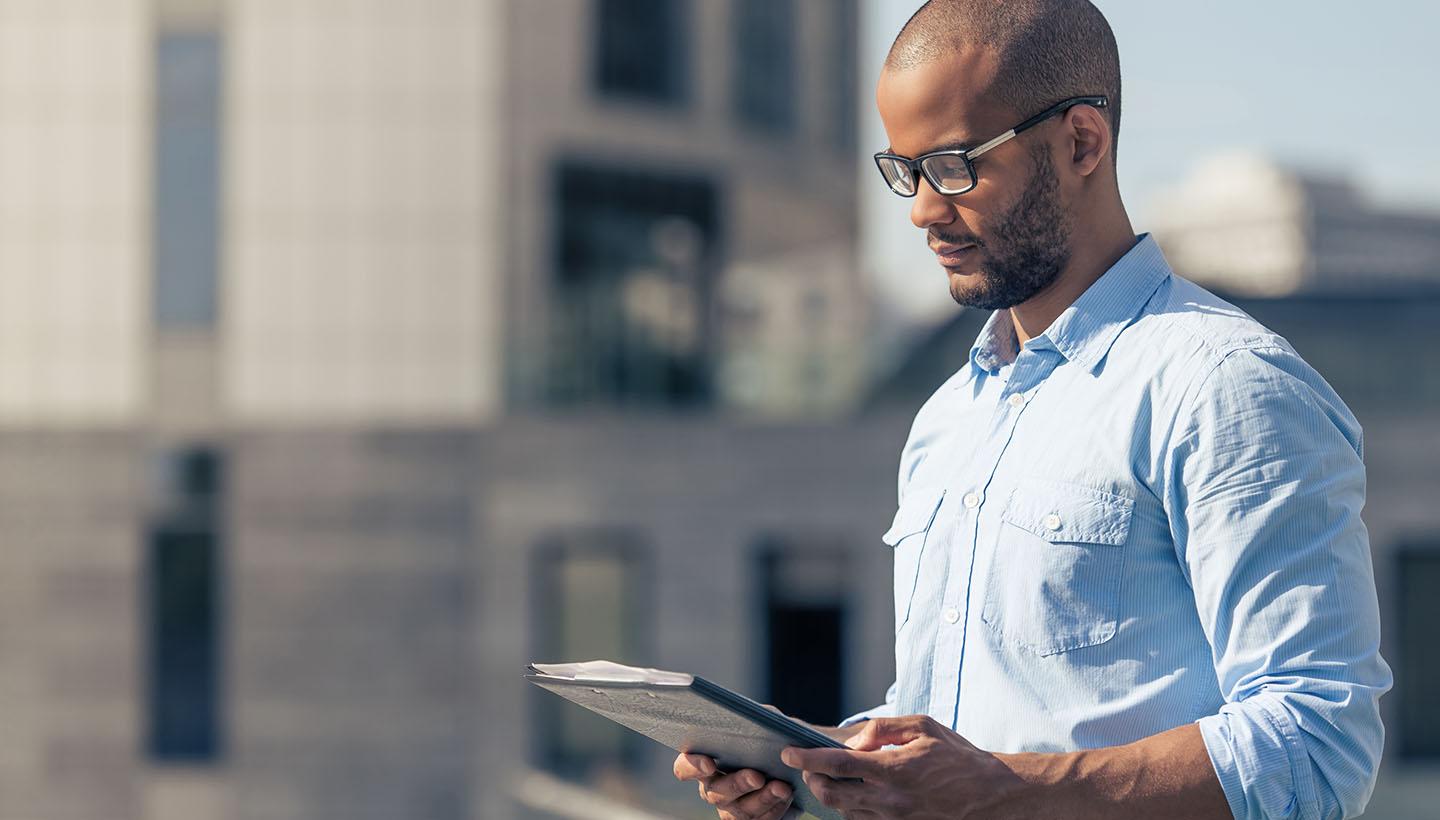 1-BenefitsSpecializingCommercialPropertyInspections-1440×820 A Certified Commercial Property Inspector completing an inspection report