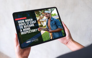 Black tablet displaying cover page of AHIT Ebook: How Much Does It Cost to Become a Home Inspector?